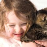 Girl holding cat